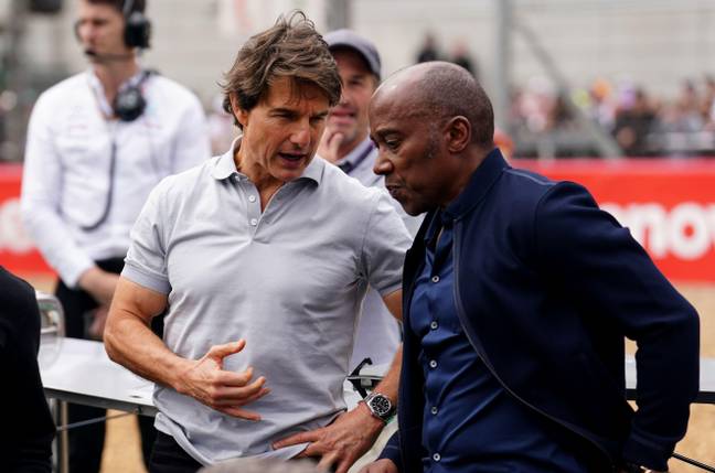 Anthony Hamilton chatting with Tom Cruise ahead of a race. Image: Alamy