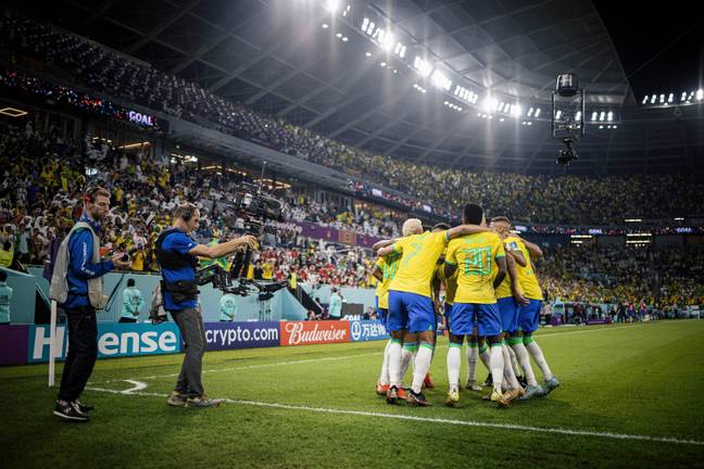 Brazil players celebrate their fourth goal. Image: Alamy