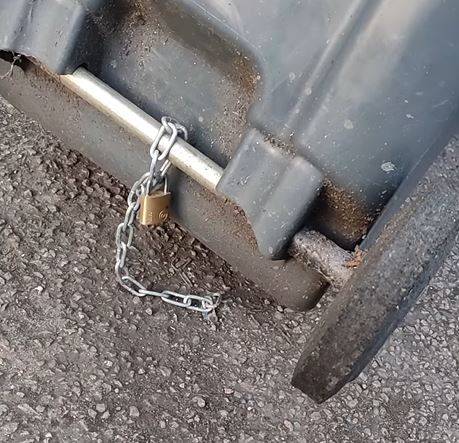 Wheelie bin chained to the road (Suhad Miah/Facebook)