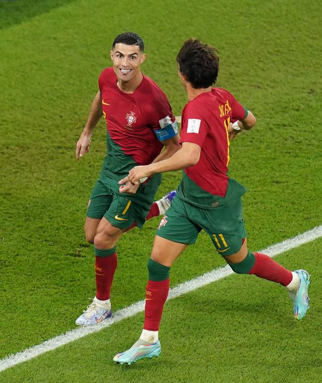 Portugal's Cristiano Ronaldo (left) celebrates scoring their side's first goal of the game from the penalty spot during the FIFA World Cup Group H match at Stadium 974 in Doha, Qatar. Credit: PA Images / Alamy 
