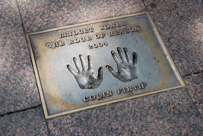 Colin Firth handprints in pavement commemorating the film Bridget Jones the Edge of Reason Leicester Square London. Credit: Alamy