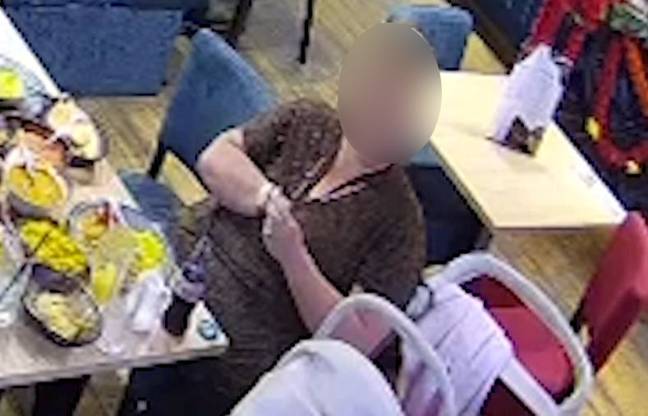 CCTV footage appears to show the customer planting plastic in her curry. Credit: SWNS