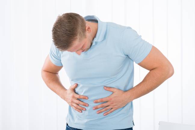 Man with stomach ache. Credit: Alamy