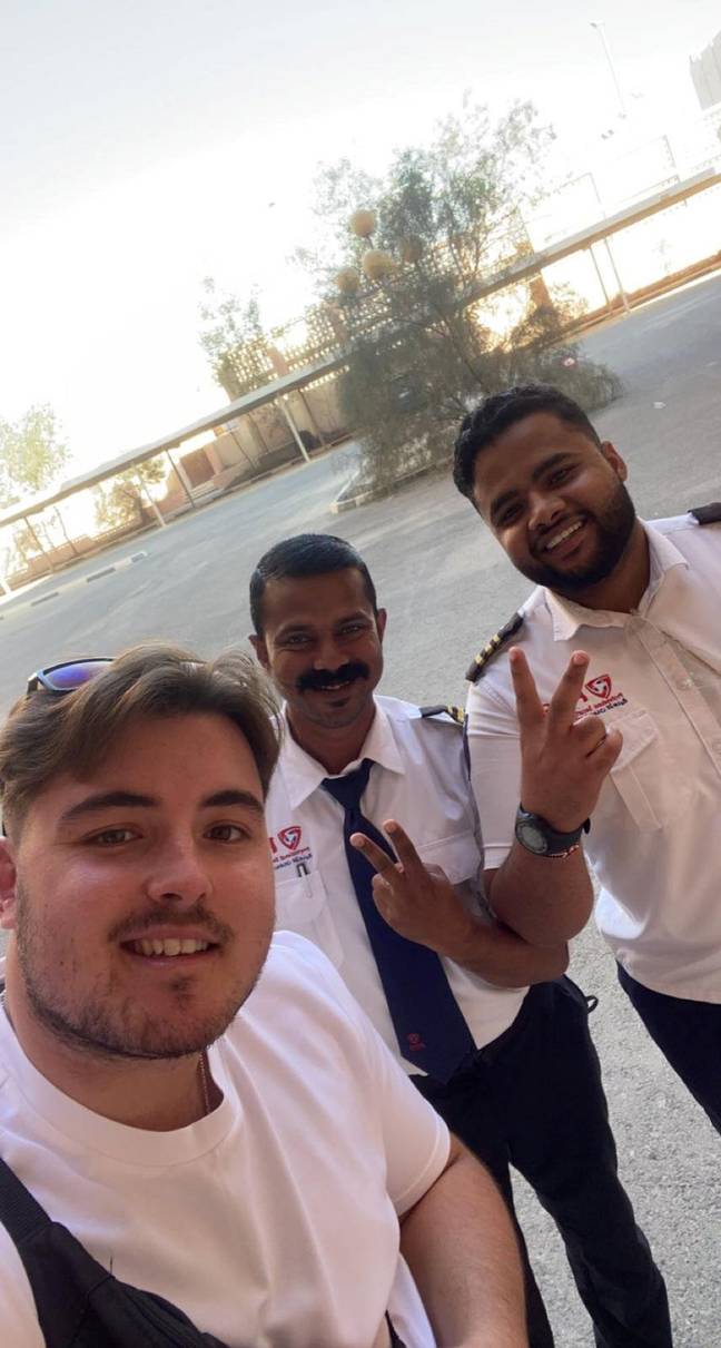 Rob with Sadiq the security guard and his colleague. Credit: SWNS