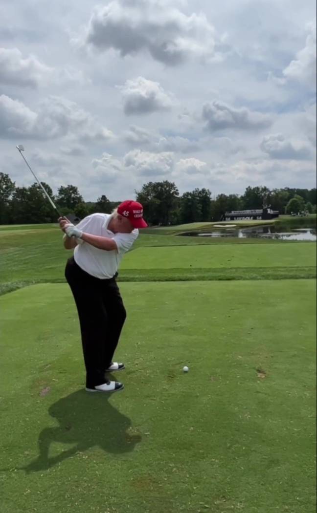 Donald Trump was heckled for his poor swing. Credit: Kennedy
