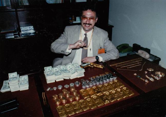 Pena, pictured next to a mountain of seized gold, was shocked by the violence he encountered. Credit: Steve Murphy &amp; Javier Pena
