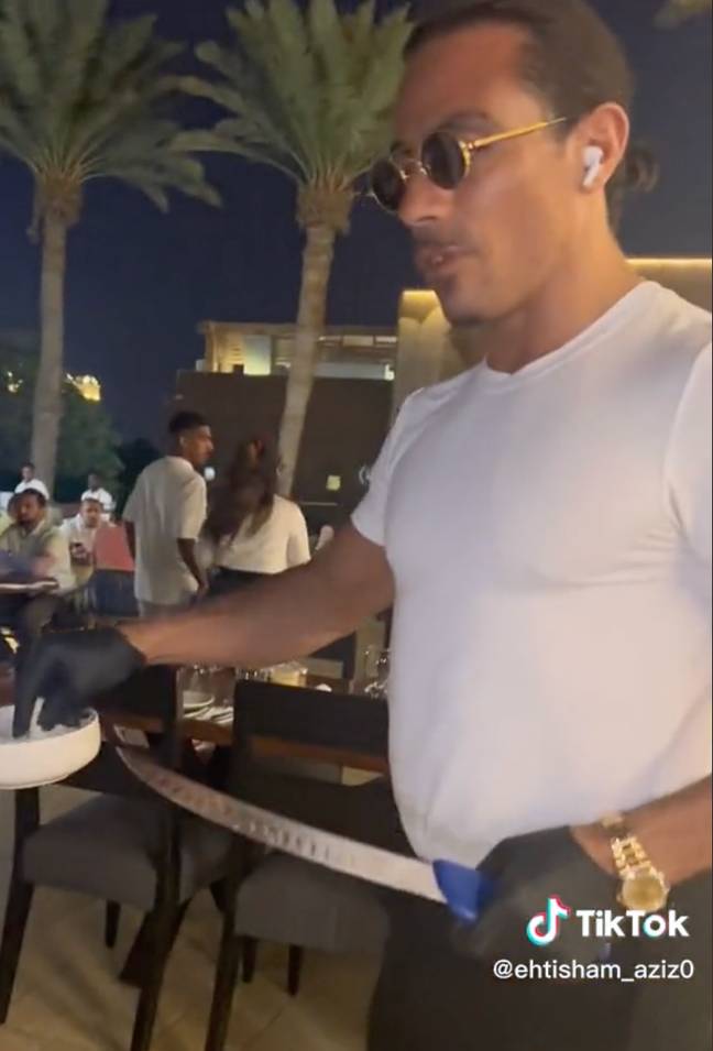 Salt Bae was allegedly talking on his AirPods while serving the table. Credit: @ehtisham_aziz0/ TikTok