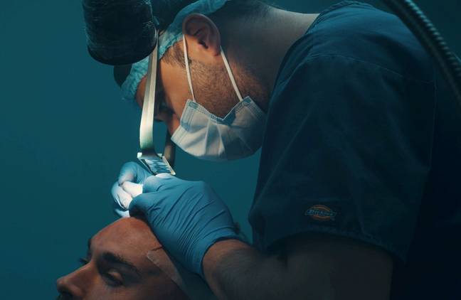 Hair transplant surgeon Dr Umear Ahmad. Credit: Kennedy News and Media