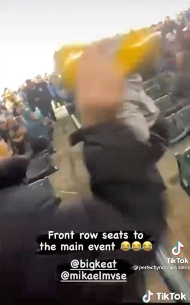 Other fans hurled beer at the woman who objected. Credit: TikTok