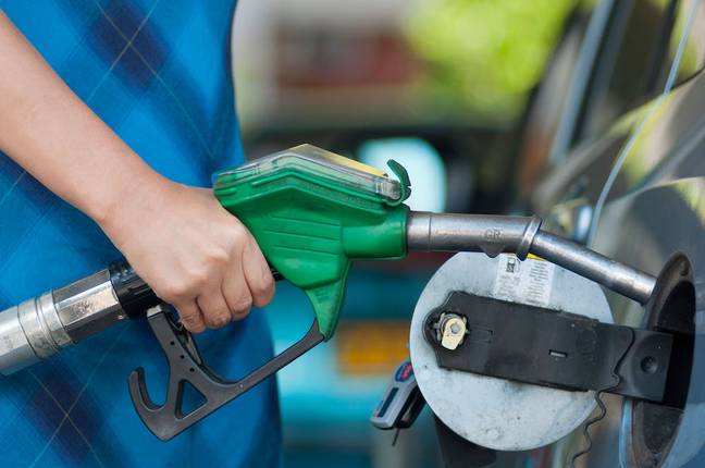 Fuel pumps are controlled by the petrol station staff. Credit: Andrew Michael/Alamy Stock Photo