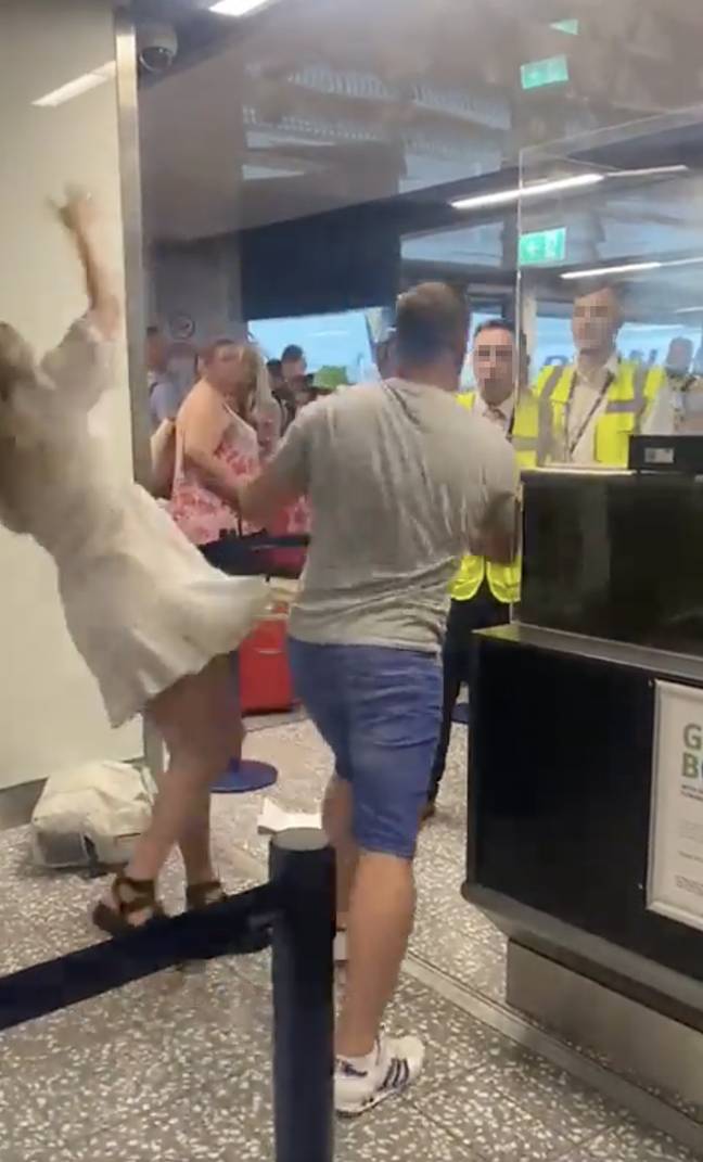 The man shoved the woman to the floor and then hit a member of staff. Credit: @dubslife1/Twitter