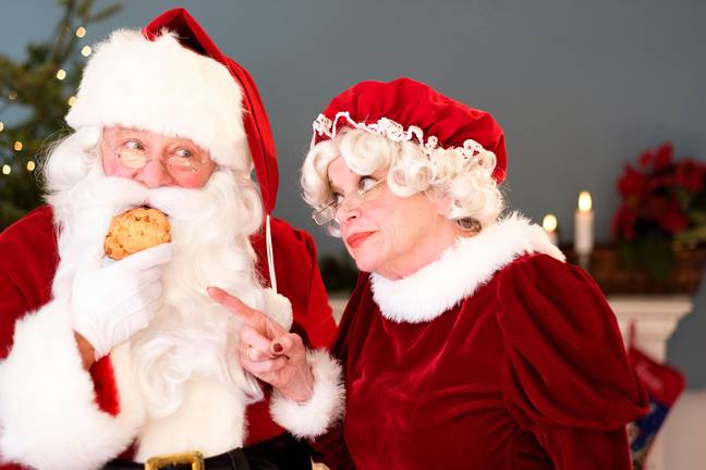 Mrs. Claus is watching Santa's weight for him. Credit: Tetra Images / Alamy Stock Photo