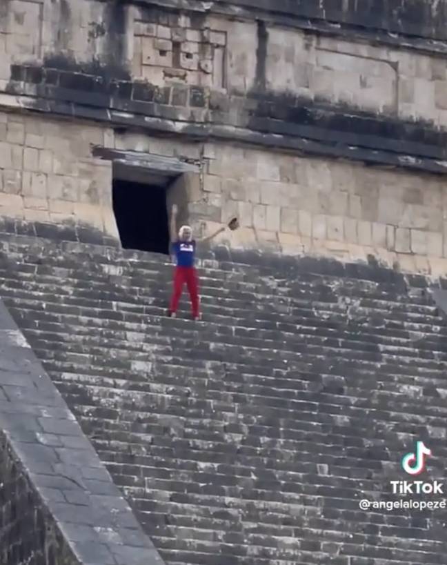 The woman further angered the crowd by dancing on the pyramid. Credit: Storyful