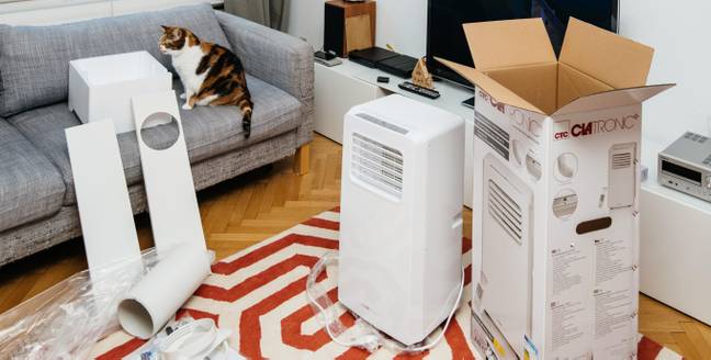 A portable air conditioning unit could set you back £19.60 a week. Credit: Alamy