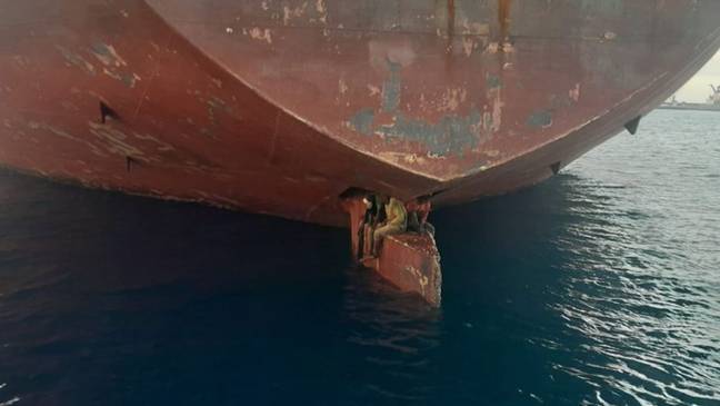 Three migrants who stowed themselves away on the rudder of a tanker have been rescued. Twitter/@salvamentogob
