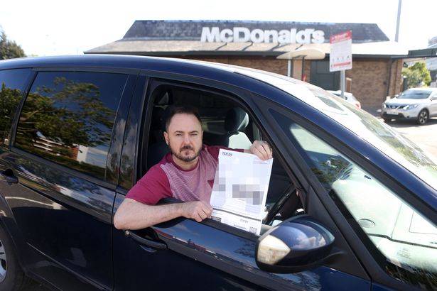 Spencer Barclay outside the McDonald's he was fined at. Credit: NCJ Media