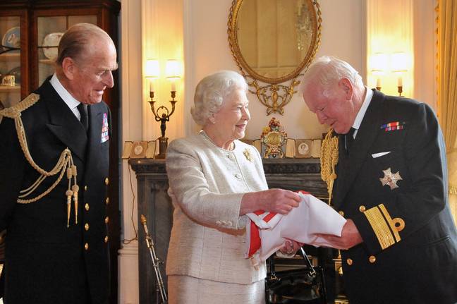 The late Prince Philip and Queen Elizabeth II with Sir Donald Gosling. Credit: Alamy