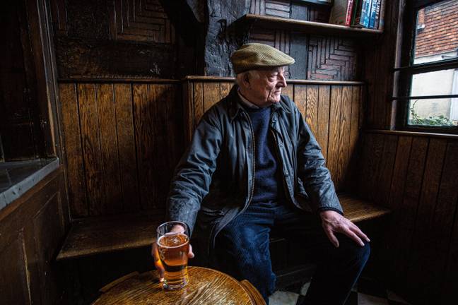 Man drinks pint and reflects on failed Dry January bid. Credit: horst friedrichs / Alamy Stock Photo