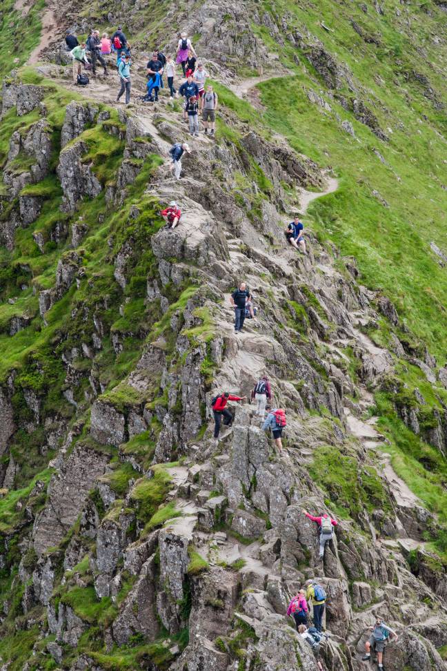 Striding Edge is a sharp mountain edge in the Lake District which connects to the summit of Helvellyn. Credit: Alamy.