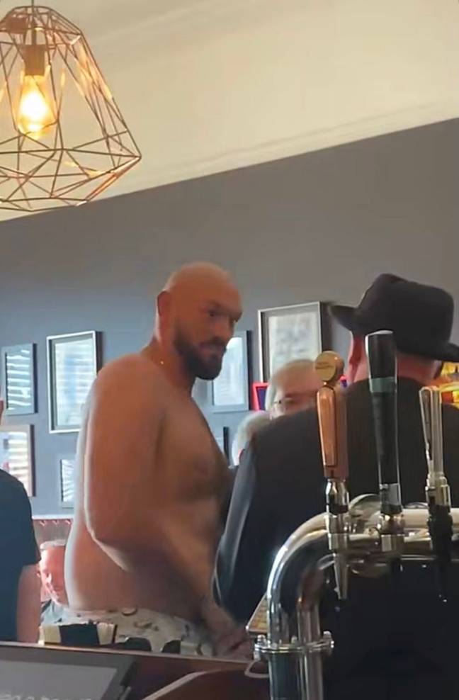 Tyson Fury whipped his top off during a trip to the pub with his mates. Credit: Twitter/@any_spare