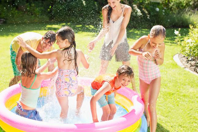 Many of us are digging out our paddling pools to cool down. Credit: Alamy
