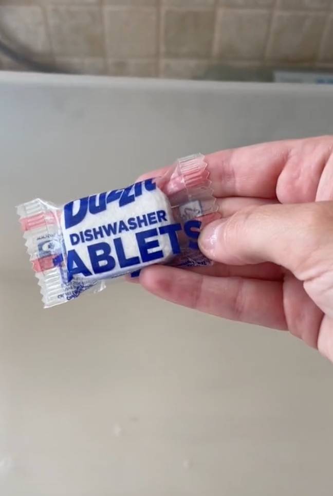 You need a dishwasher tablet for the hack to work. Credit: @ajvaughan/TikTok