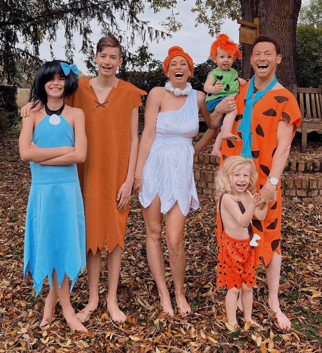 The family dressed as the Flintstones for Halloween. Credit: @staceysolomon/Instagram