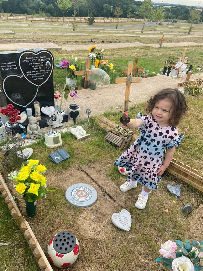 Little Harper-May by her father's grave. Credit: BPM Media