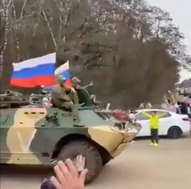 Russian civilians have been recorded cheering troops on as they go to fight in Ukraine. Credit: @DefenceU/Twitter