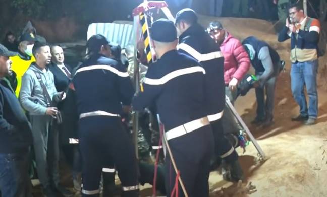 Rescue workers at well (BBC News)