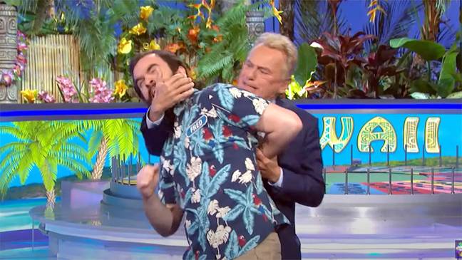 Sajak tackled Fred at the end of Tuesday's show. Credit: NBC