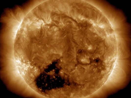Coronal holes appear as dark patches. Credit: NASA/Solar Dynamics Observatory