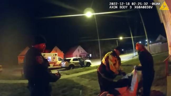 Bodycam footage shows the two paramedics putting the man on the stretcher. Credit: Sangamon County Government/ YouTube 