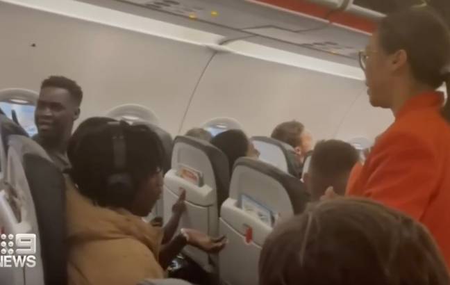 The dad claims a flight attendant told him it was fine for him to sit with his family. Credit: 9News