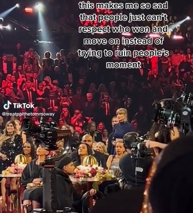 Taylor Swift remains standing whilst Harry Styles gives his acceptance speech. Credit: TikTok 
