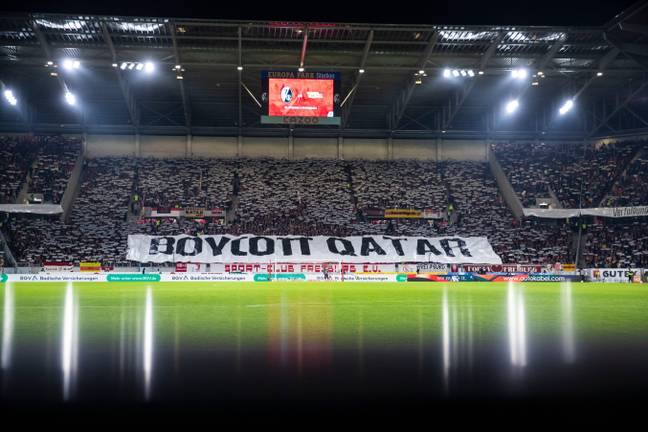 Freiburg fans before the November 13 game in Germany hold up a banner with the inscription 'Boycott Qatar' as a protest action against the World Cup in Qatar.