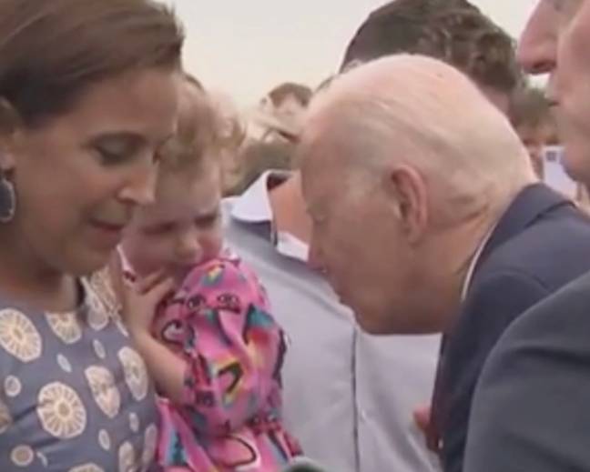 Joe Biden pretends to gobble up little girl before sniffing her in Joe Biden pretends to gobble up little girl before sniffing her in