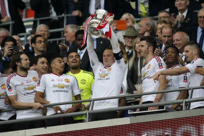 Rooney lifts the FA Cup after knockout Everton out of the competition. Image: Alamy