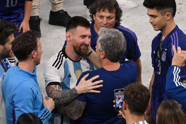 Messi with father Jorge at the World Cup final. Image: Alamy