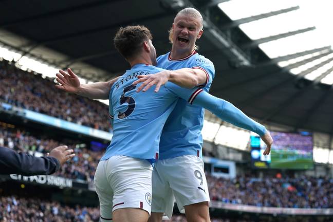 Erling Haaland celebrating with John Stones for Manchester City