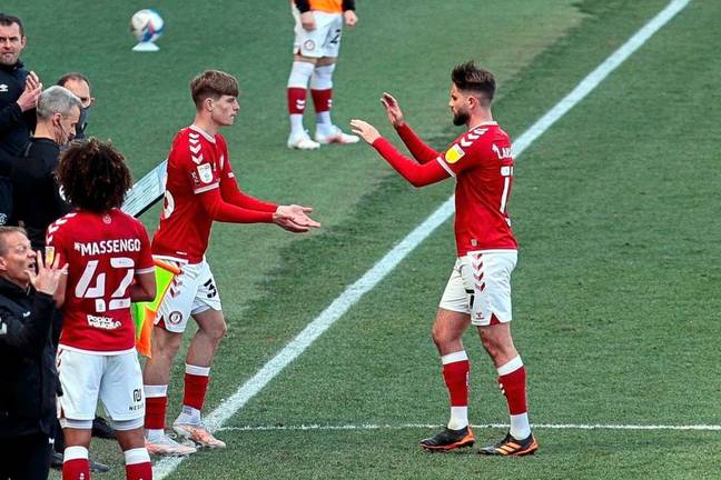 A moment he will never forget. Alex Scott replaces Henri Lansbury to make his debut for Bristol City. (Image credit: JMPUK/guernseypress) 