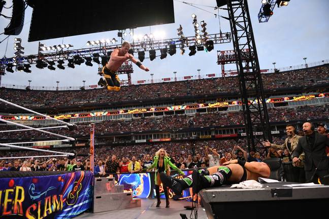 Paul hit an elbow drop on The Miz through a table at SummerSlam. (Image Credit: Alamy)