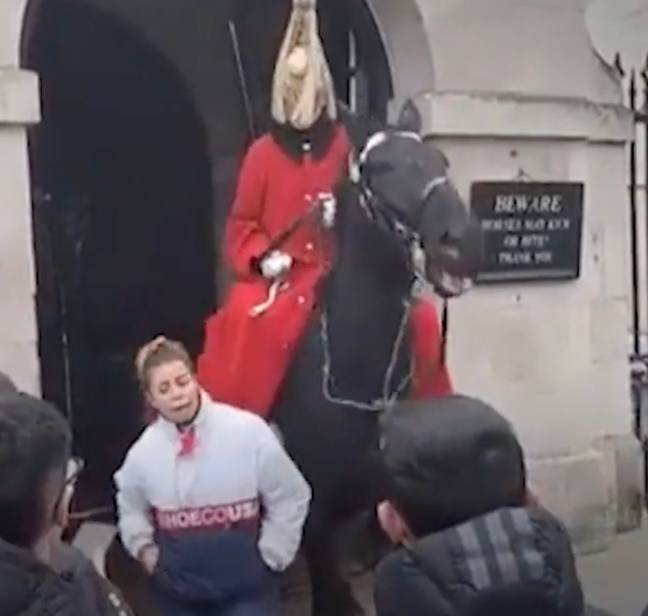 She's shouted at by the guard. Credit: @Busk976/TikTok