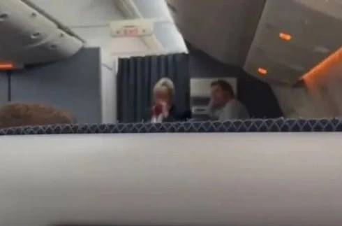 Cabin crew staff were visible devastated hearing the news. Credit:  YouTube/Storyful 