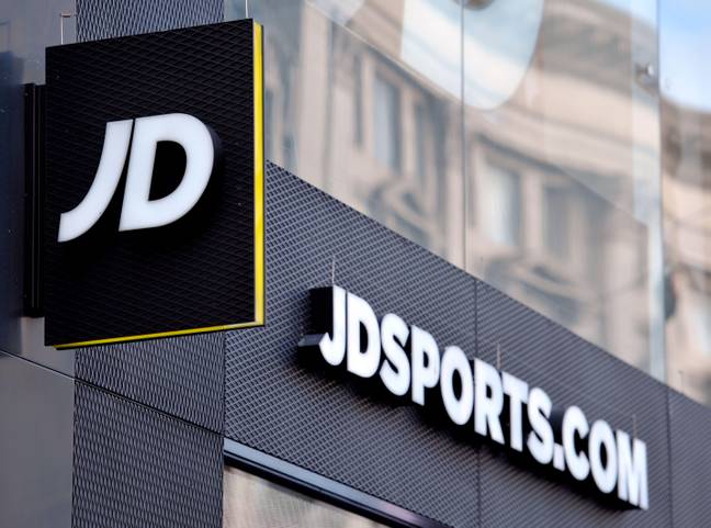 People at the doors of JD Sport aren't just there to greet customers. Credit: PA Images/Alamy Stock Photo