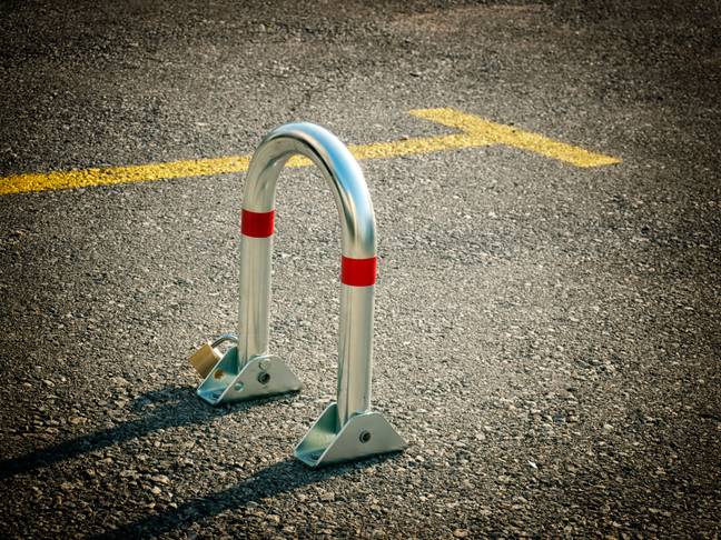 The neighbour installed a parking bollard. Credit: Botastock images / Alamy Stock Photo