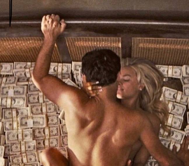 The infamous scene involving Margot Robbie, Leonardo DiCaprio, a bed and a lot of fake cash. Credit: Paramount Pictures