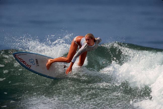 Hamilton surfing during a 2004 visit to California. Credit:  Zuma Press, Inc. / Alamy 