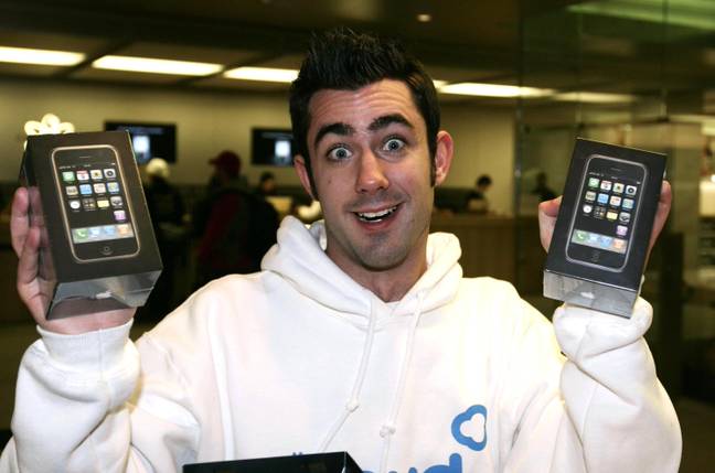 One happy punter with not one but TWO original iPhones in 2007. Credit: PA Images / Alamy 