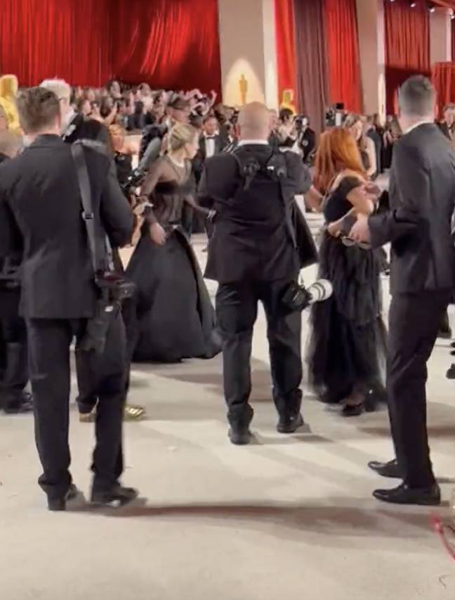 Lady Gaga rushes to save paparazzi after he falls on Oscars red carpet